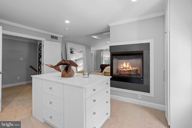 walk in closet featuring light carpet and a multi sided fireplace