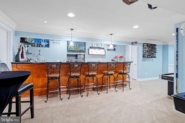 bar with decorative light fixtures, ornamental molding, and light carpet