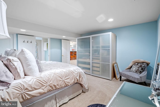 bedroom featuring light colored carpet