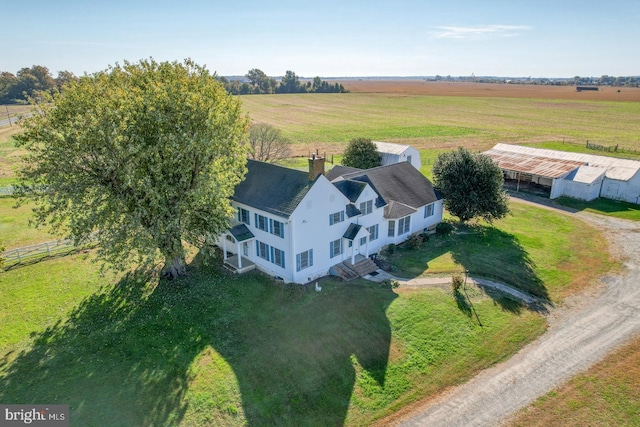 birds eye view of property featuring a rural view