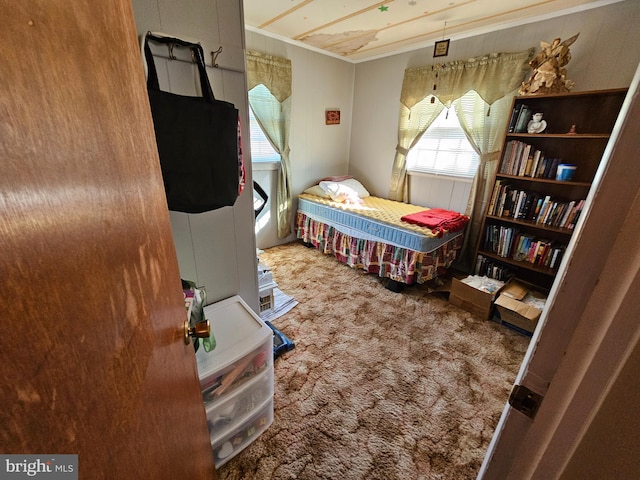 bedroom featuring carpet and ornamental molding