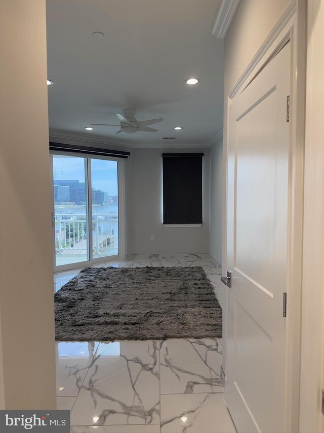 interior space featuring crown molding, tile floors, and ceiling fan