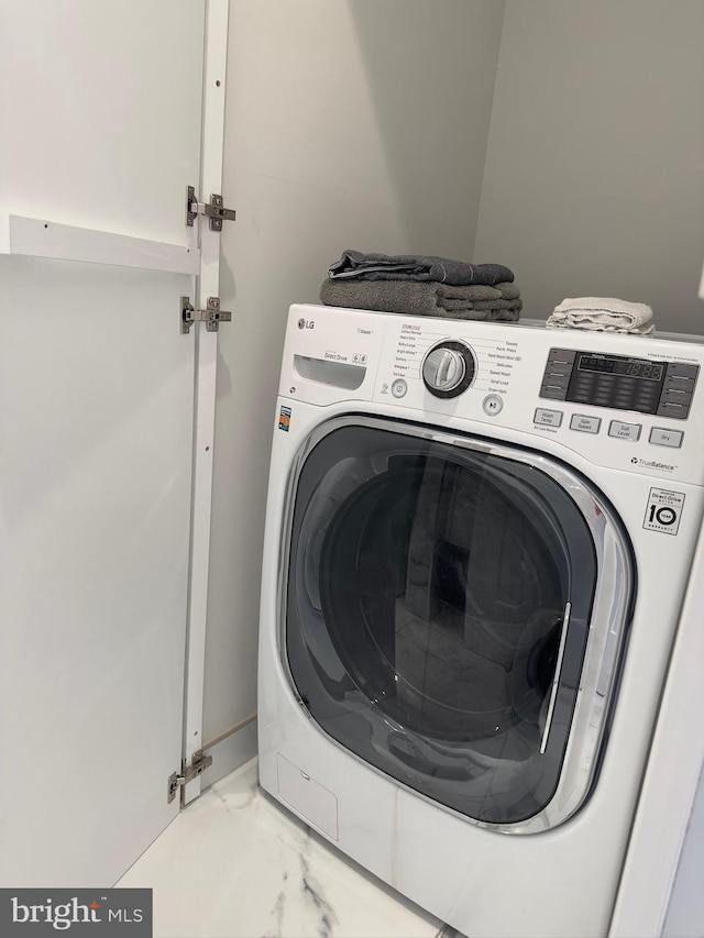 clothes washing area featuring washer / clothes dryer