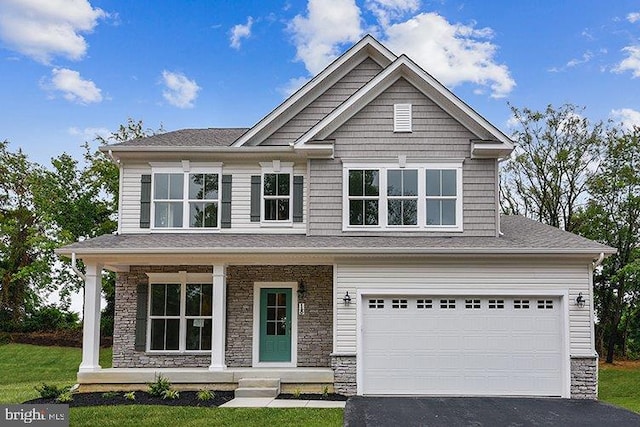 craftsman-style home featuring a porch and a garage