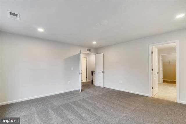 spare room featuring light tile flooring