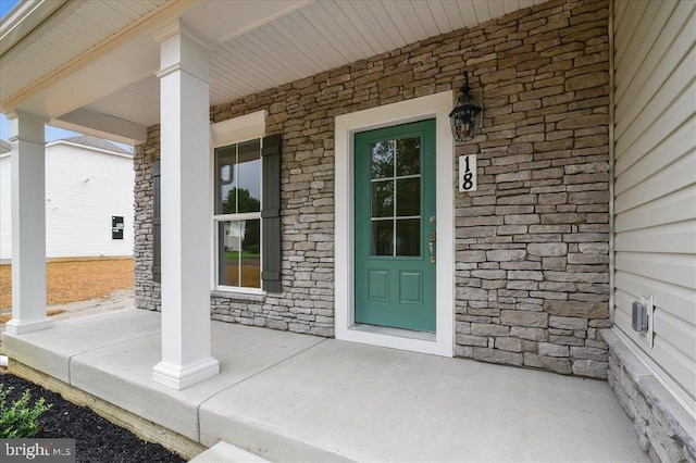 doorway to property with a porch