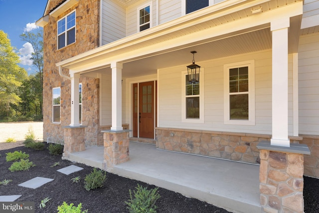 entrance to property featuring a porch