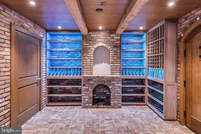 wine cellar with brick wall and wood ceiling