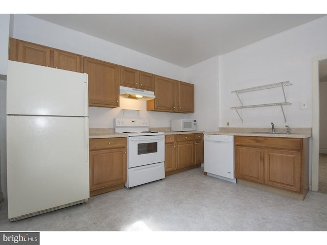 kitchen with white appliances and sink