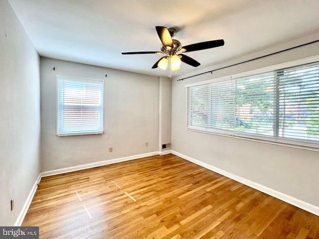 spare room featuring ceiling fan and light hardwood / wood-style floors