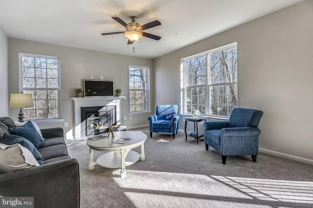 living room with light colored carpet and ceiling fan