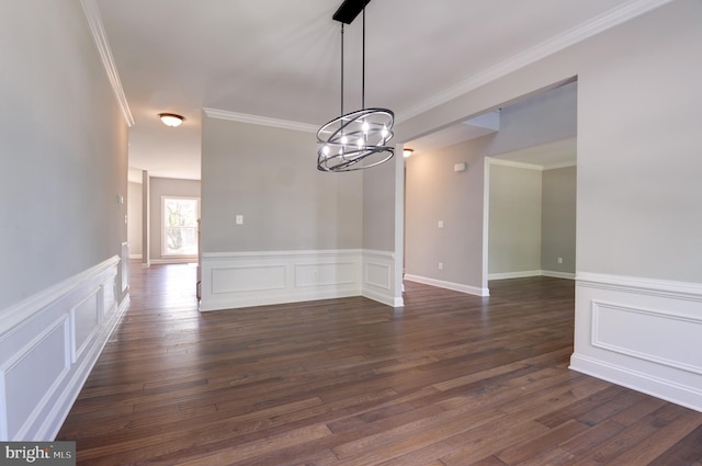 interior space featuring a chandelier, dark hardwood / wood-style flooring, and crown molding