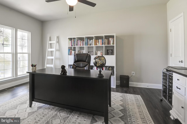 office space with dark hardwood / wood-style flooring and ceiling fan