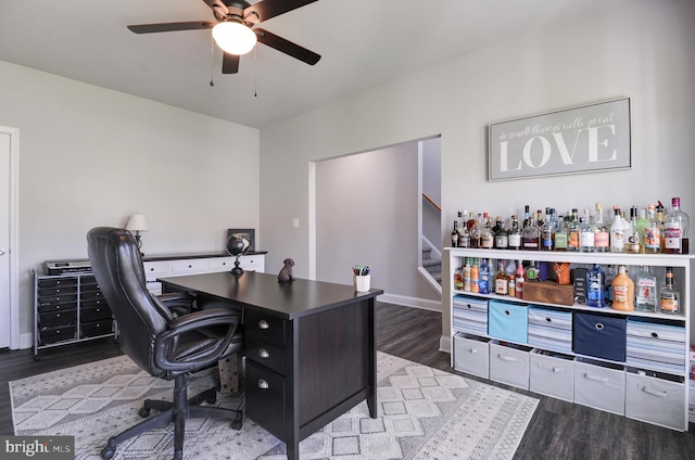 home office featuring hardwood / wood-style flooring and ceiling fan