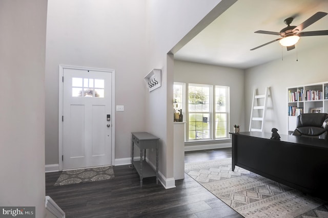 foyer with dark hardwood / wood-style floors, ceiling fan, and a healthy amount of sunlight