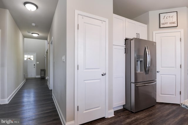 kitchen with dark hardwood / wood-style floors, white cabinetry, and stainless steel refrigerator with ice dispenser