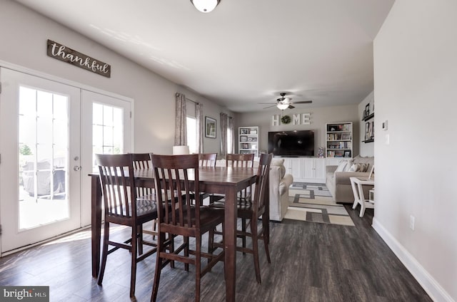 dining space featuring ceiling fan, french doors, and dark wood-type flooring