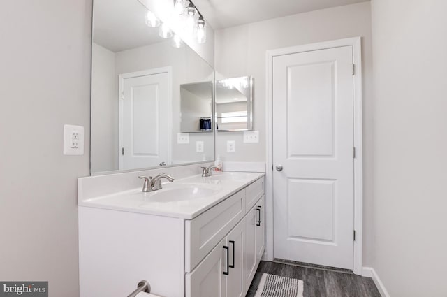 bathroom featuring hardwood / wood-style flooring and vanity