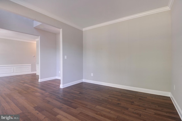 unfurnished room featuring crown molding and dark wood-type flooring