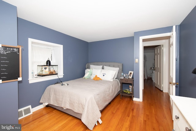 bedroom with light hardwood / wood-style flooring