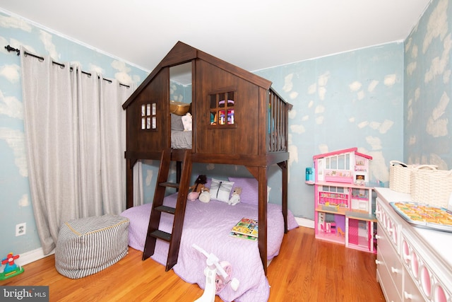 bedroom with light wood-type flooring