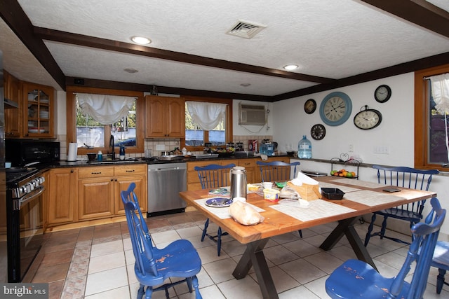 kitchen featuring range, backsplash, dishwasher, a textured ceiling, and sink