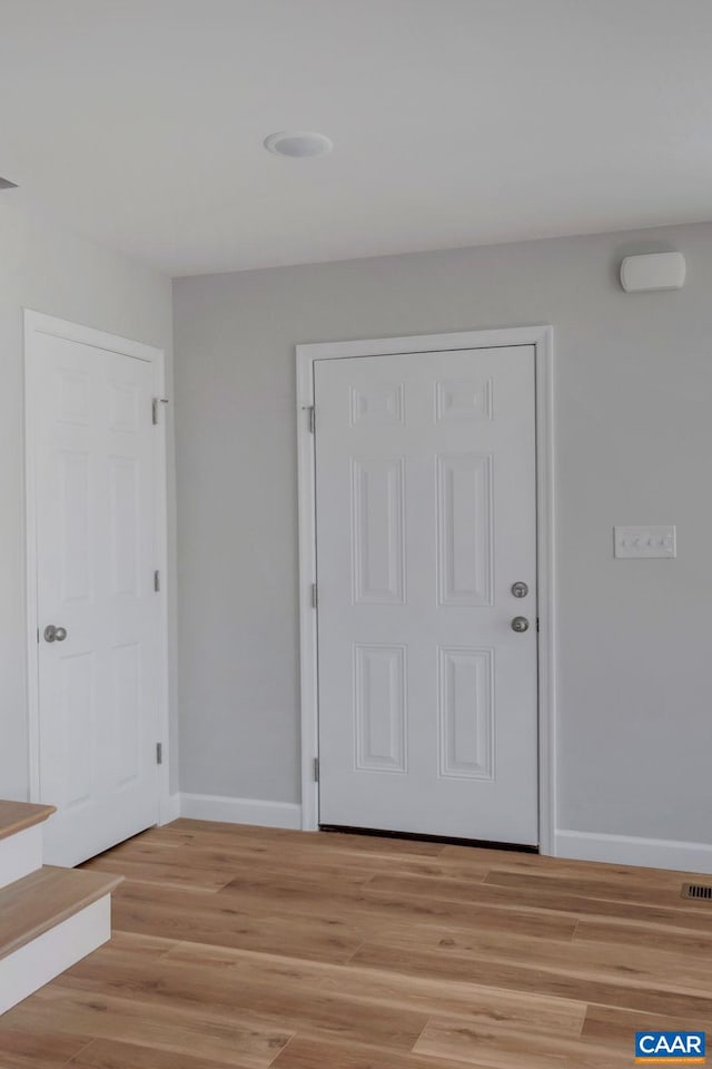 foyer with light hardwood / wood-style flooring