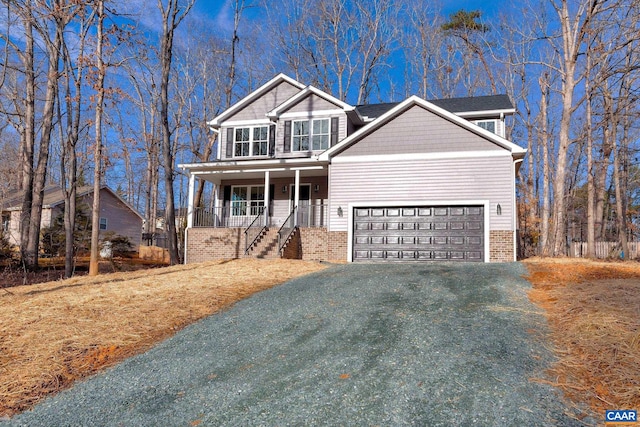 view of front facade featuring a porch and a garage