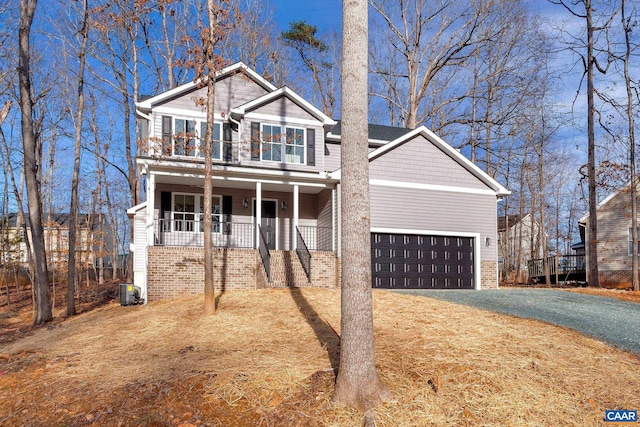 view of front of house featuring covered porch and central AC