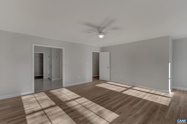 spare room featuring light hardwood / wood-style flooring and ceiling fan