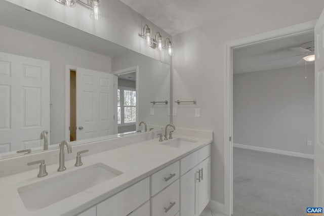 bathroom featuring double vanity and ceiling fan