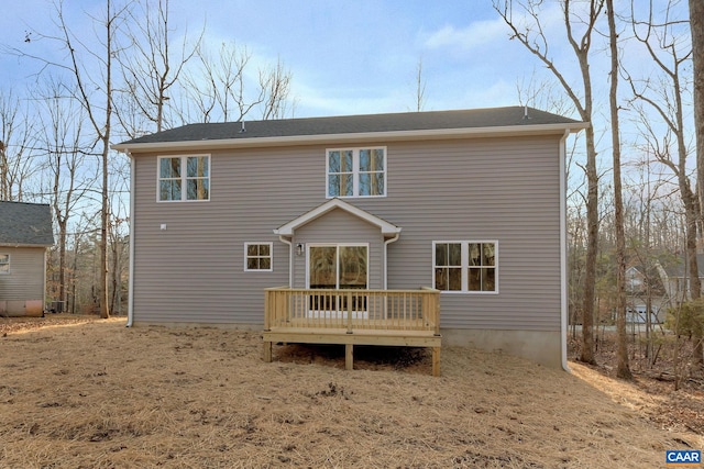 rear view of house with a wooden deck