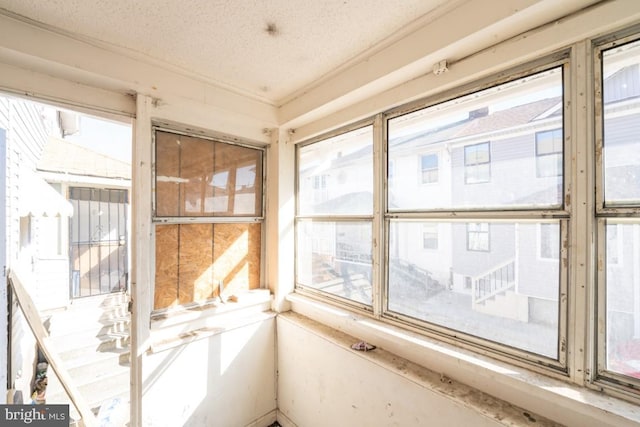 unfurnished sunroom featuring a healthy amount of sunlight