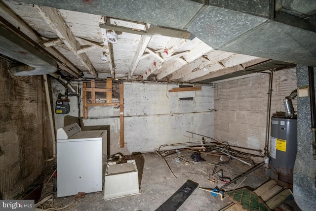 basement featuring washer / clothes dryer and water heater