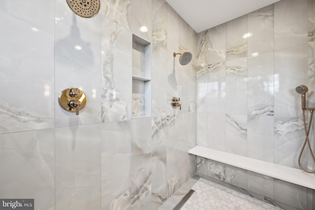 bathroom featuring tiled shower