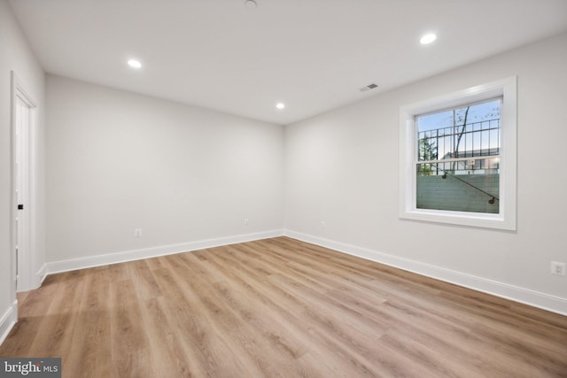 spare room featuring light hardwood / wood-style flooring