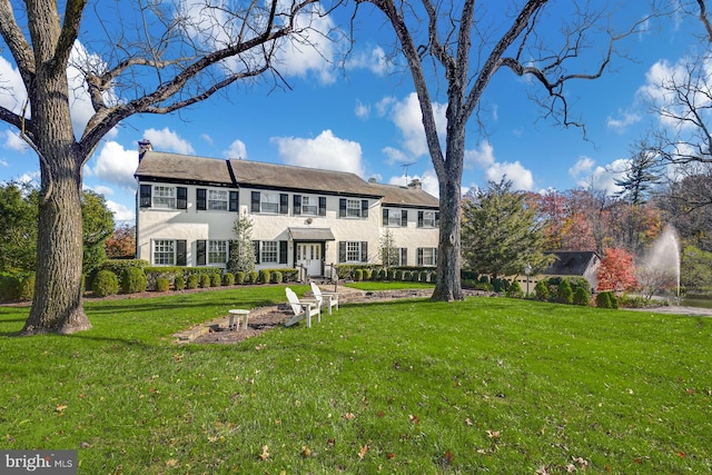 colonial home with a front yard