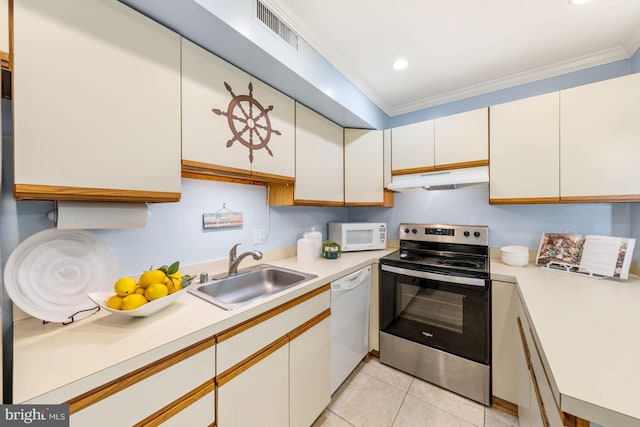 kitchen featuring white appliances, ornamental molding, sink, and white cabinetry