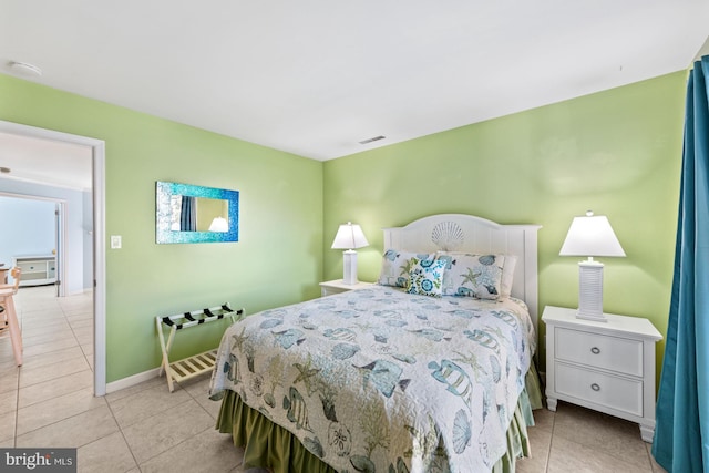 bedroom with light tile floors