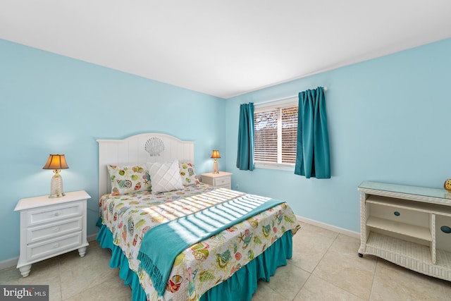 bedroom with light tile flooring