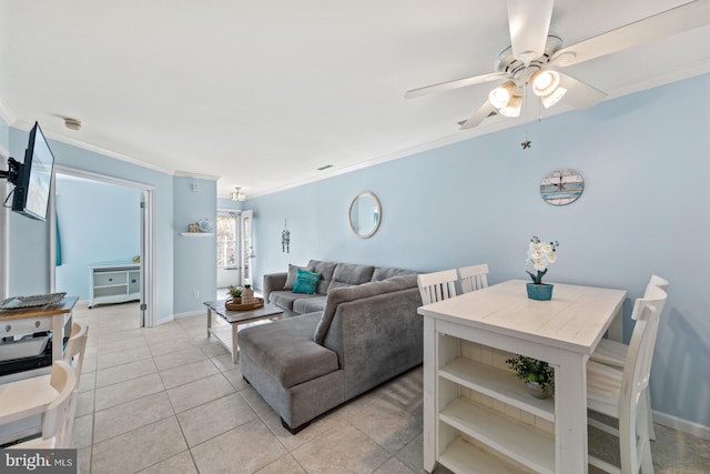 tiled living room with ornamental molding and ceiling fan