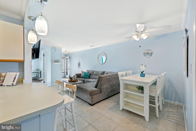 tiled living room with ceiling fan and ornamental molding