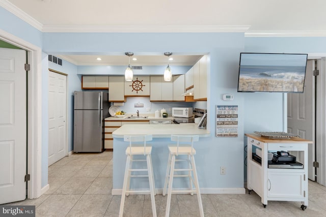 kitchen featuring stainless steel fridge, hanging light fixtures, light tile flooring, and crown molding