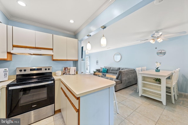 kitchen featuring kitchen peninsula, electric range, pendant lighting, ceiling fan, and light tile flooring