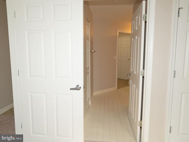 hallway featuring light carpet