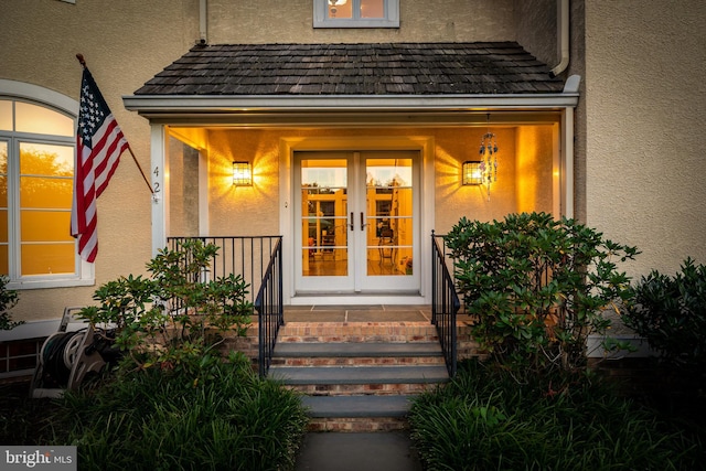 entrance to property featuring french doors