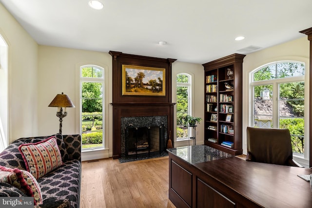 office with light wood-type flooring