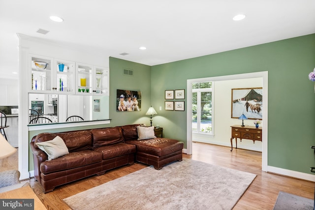 living room with light hardwood / wood-style flooring