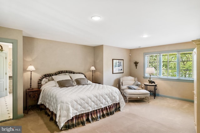 bedroom featuring light carpet