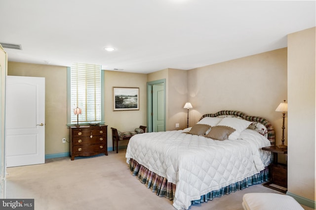 bedroom with light colored carpet